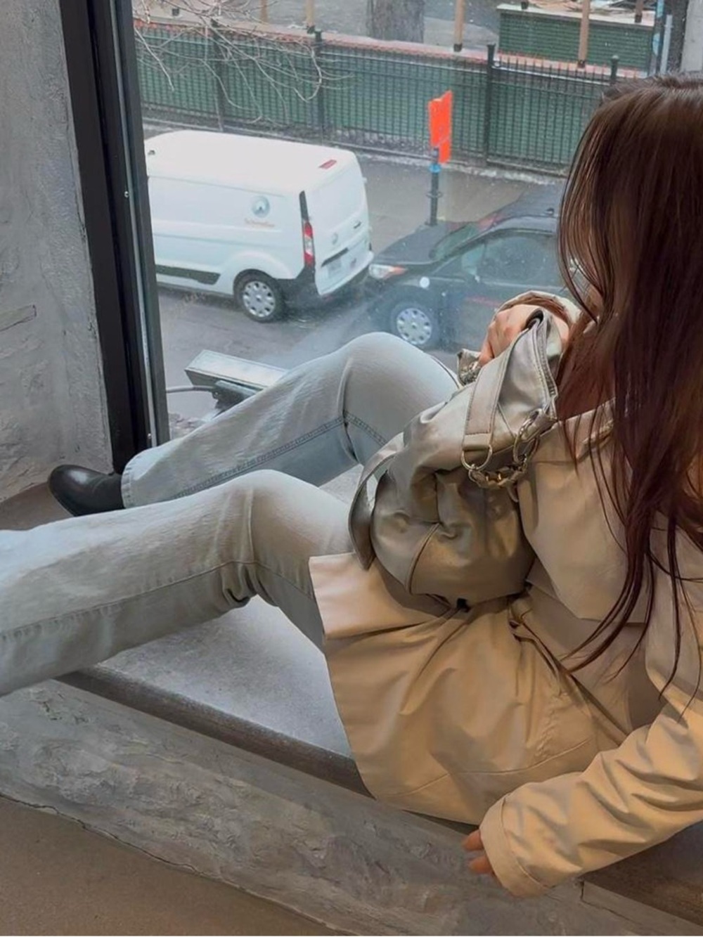 Light blue low rise bootcut jeans with button details